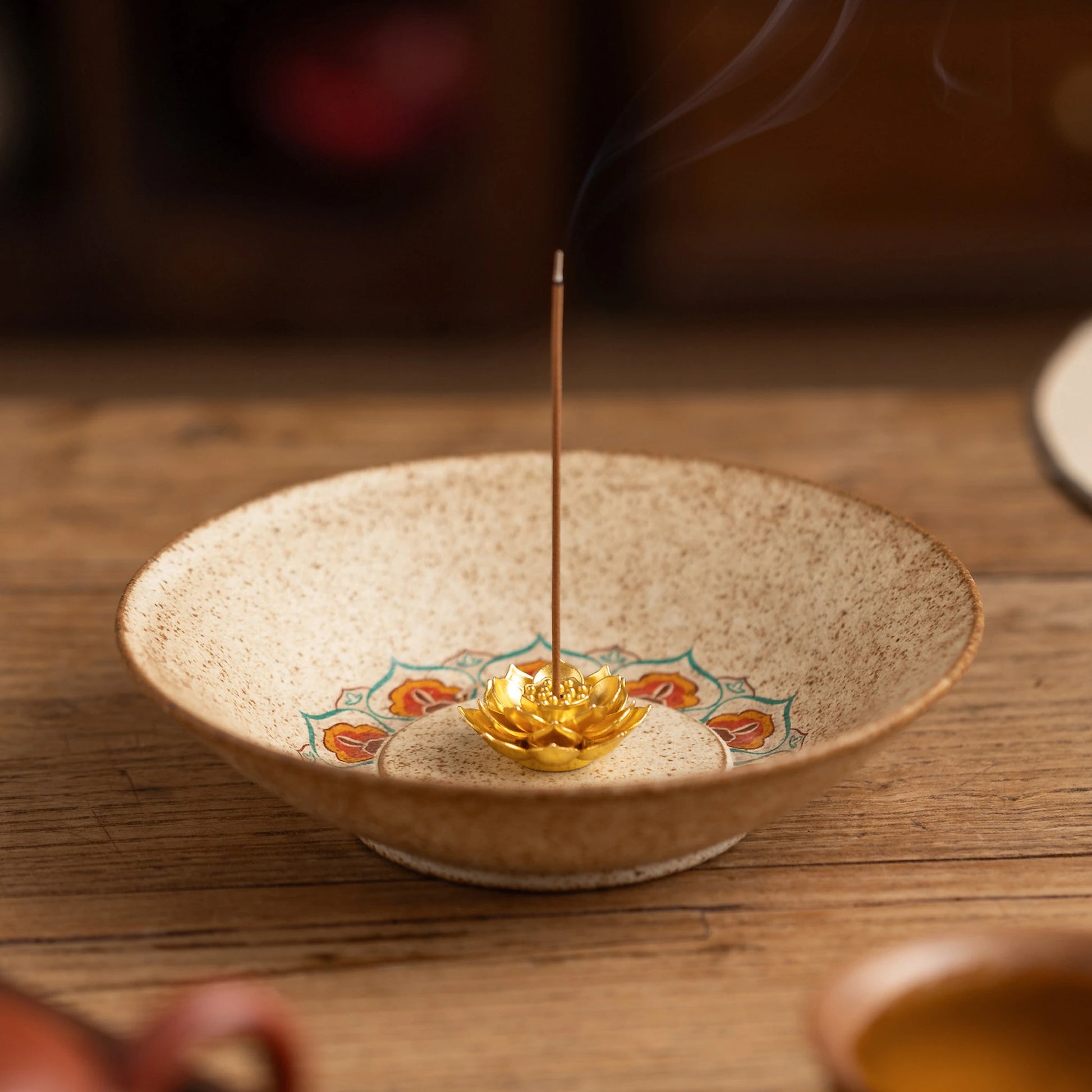 en style pottery incense burner emitting smoke, beige textured ceramic tray for yoga studio or home altar