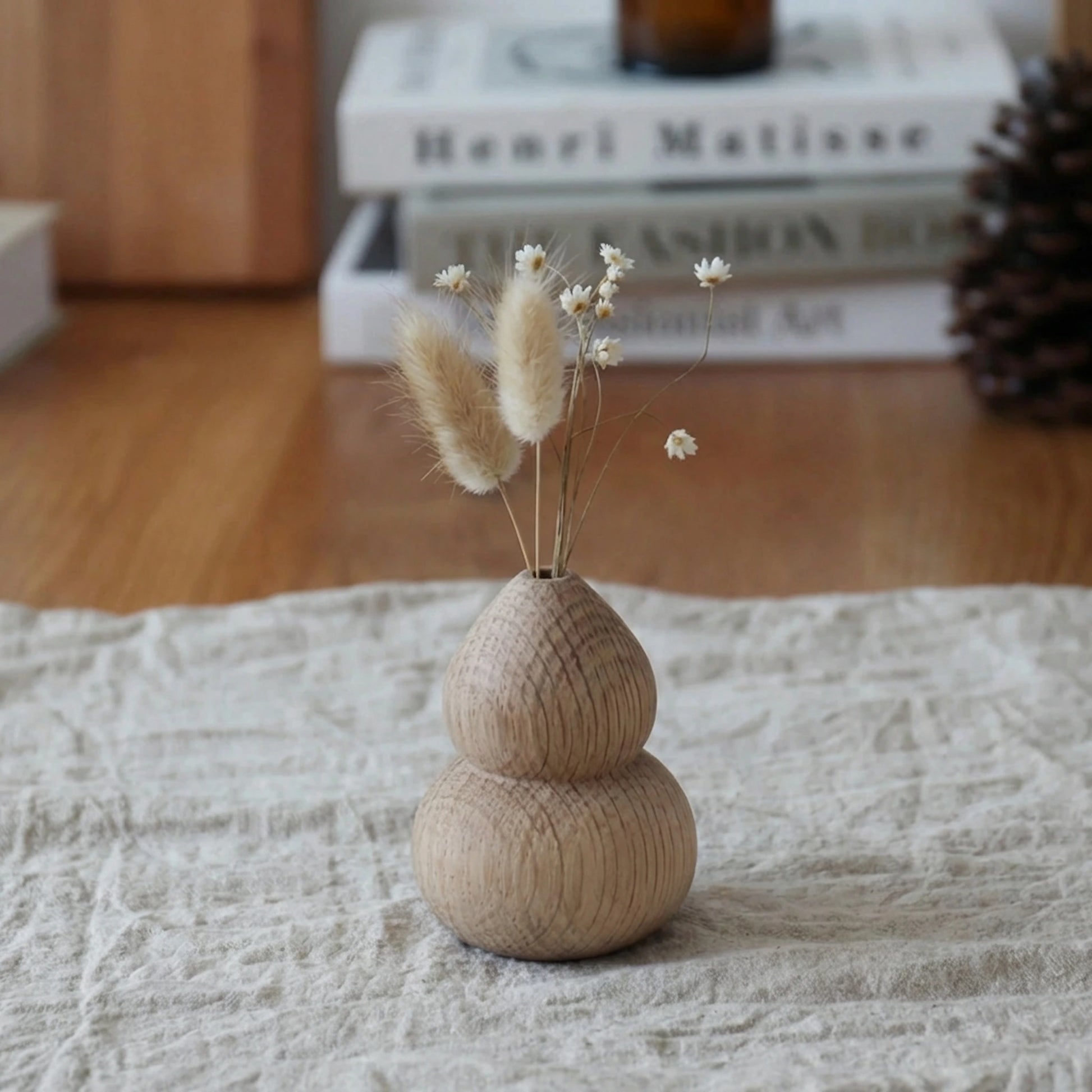 Handcrafted petite wooden bud vase made of white oak featuring natural grain with dried floral decor.